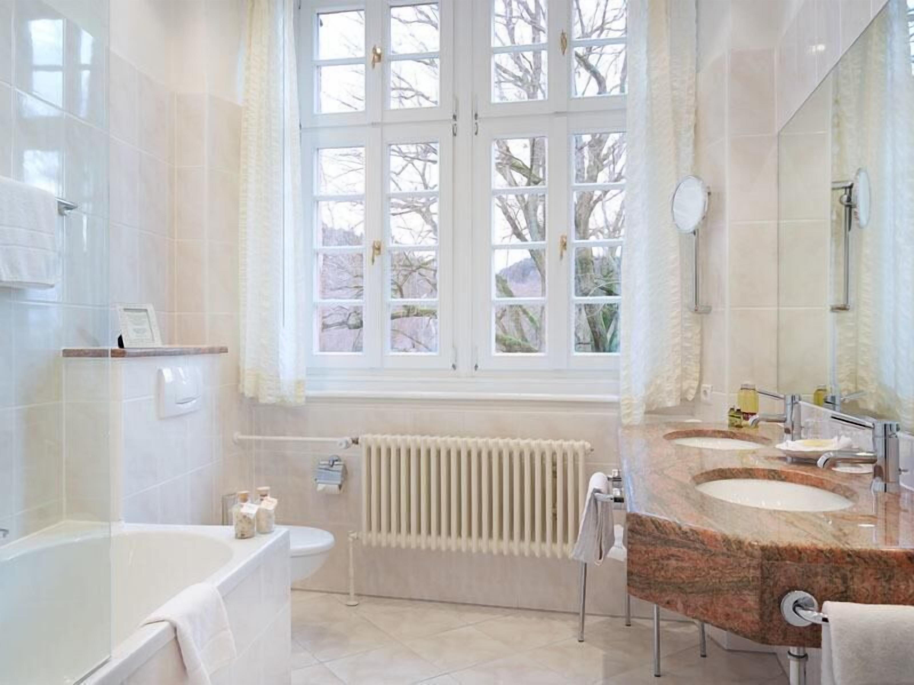 shower, hair dryer, bathrobes, slippers