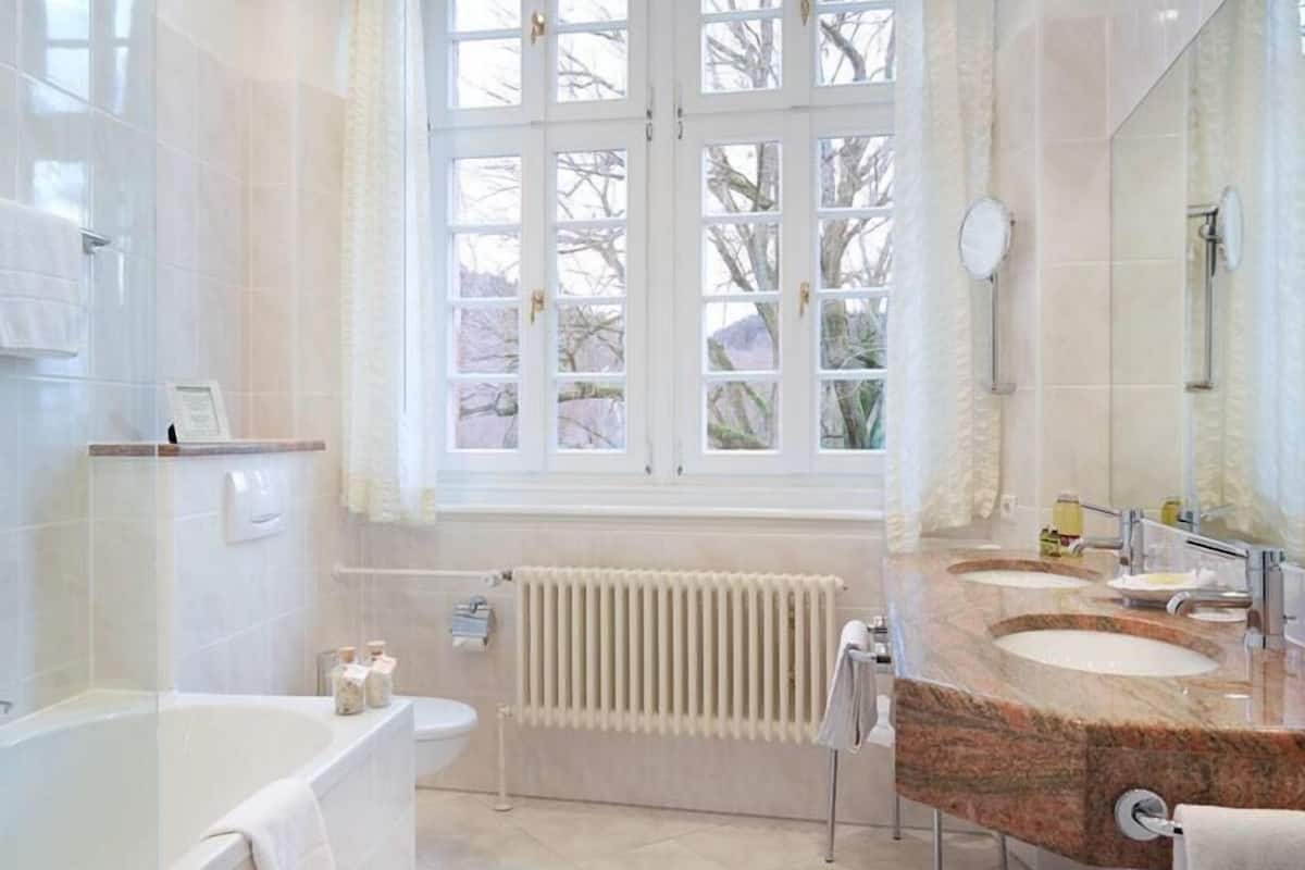 shower, hair dryer, bathrobes, slippers