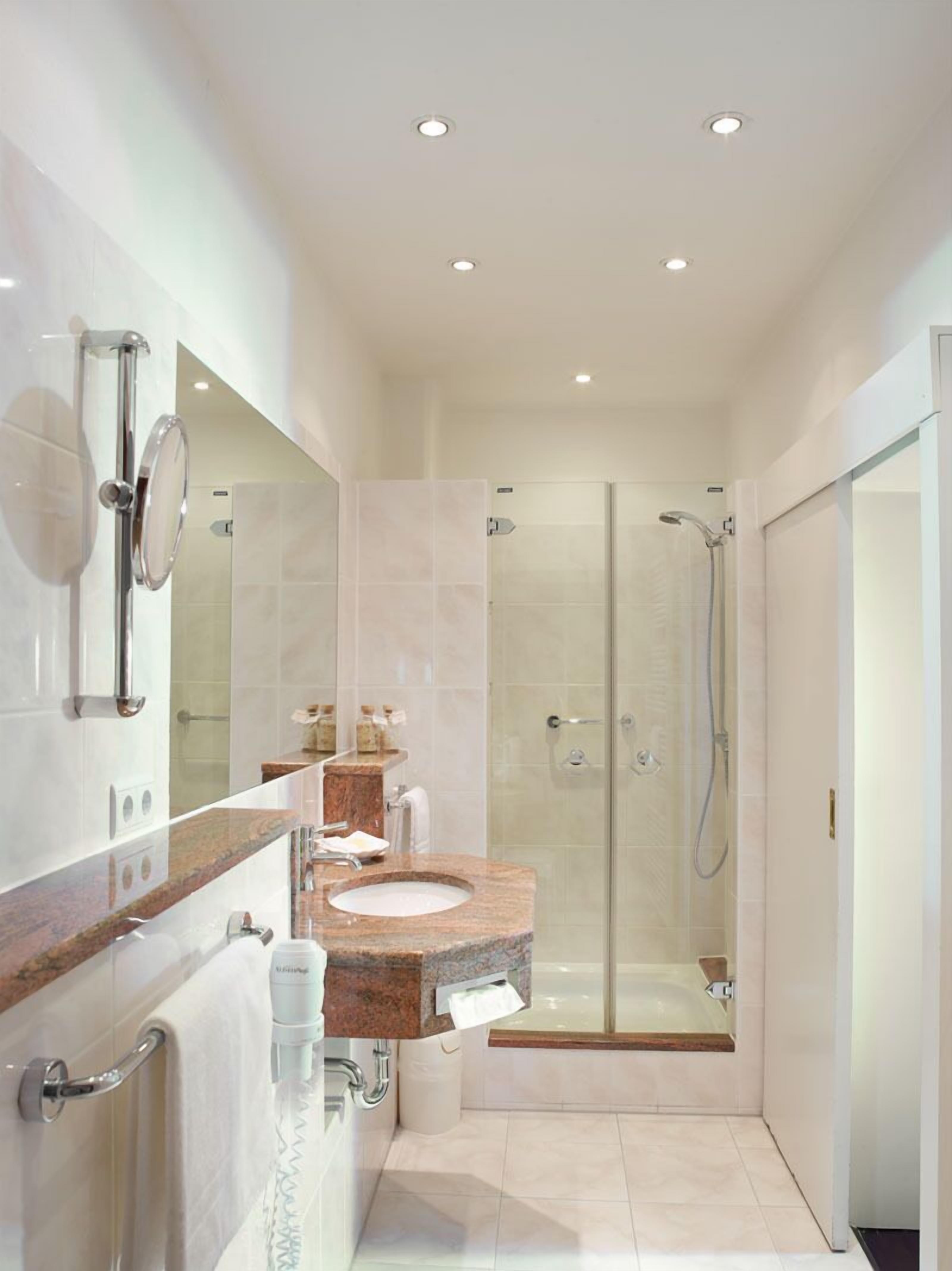 shower, hair dryer, bathrobes, slippers