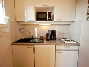 Fridge, microwave, coffee/tea maker, toaster