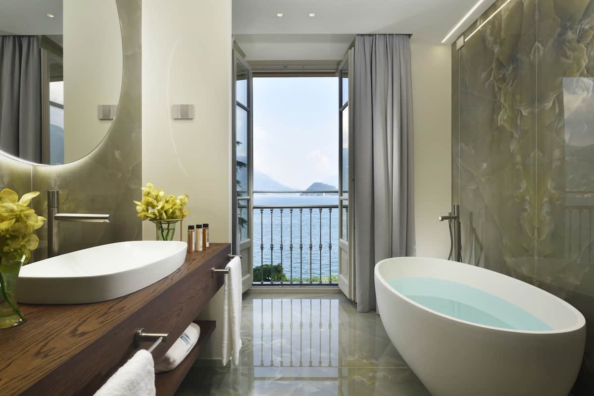 exclusive suite, 1 bedroom, lake view | bathroom | separate bathtub and shower, free toiletries, hair dryer, bathrobes
