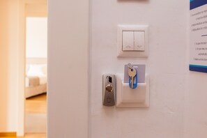 A door with a keyhole, a key, and a lock.