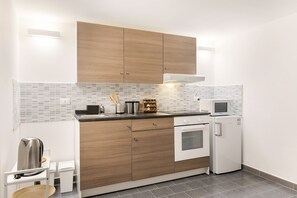 Apartment, 1 Bedroom | Private kitchen | Fridge, stovetop, electric kettle, cookware/dishes/utensils