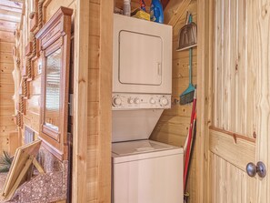A compact laundry room with a washing machine, a drying machine, and a broom. - Luxury! 2 Master Suites w/Fireplaces|Game Room (SEVIERVILLE)