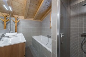 Bathtub, hair dryer, toilet paper