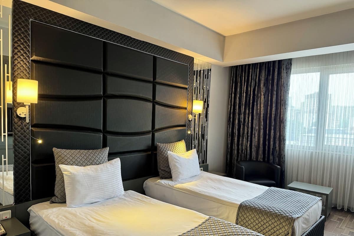 standard twin room | in-room safe, desk, blackout curtains, soundproofing