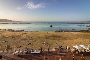 On the beach, sun loungers, beach towels
