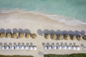 Private beach, white sand, sun loungers, beach umbrellas