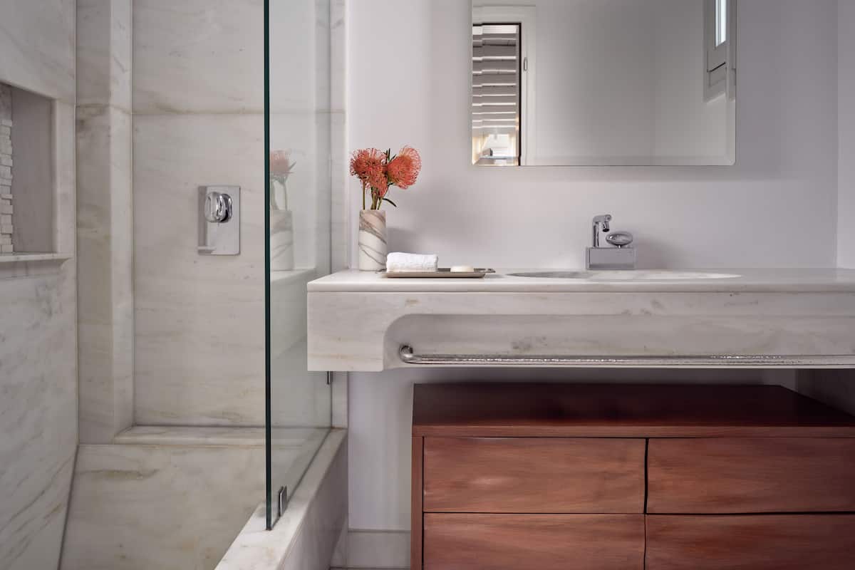 Designer toiletries, hair dryer, bathrobes, slippers