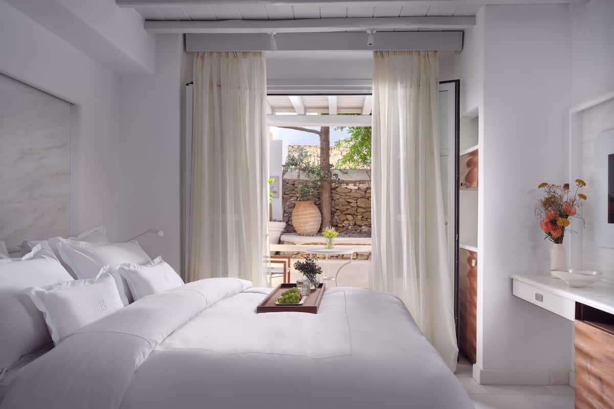 Junior Suite, Courtyard View | In-room safe, laptop workspace, soundproofing, iron/ironing board