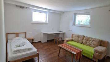 Comfort Apartment, 2 Bedrooms (Ground Floor) | Living room | Flat-screen TV, heated floors