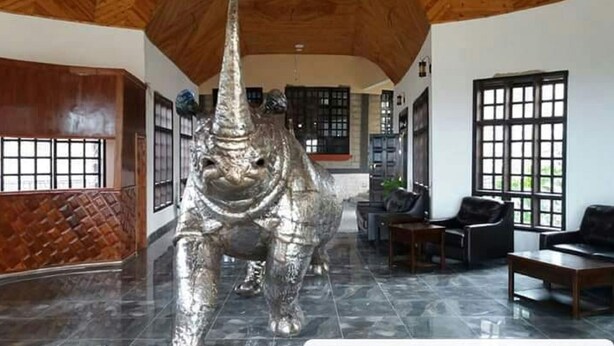 A spacious lobby with a large silver elephant sculpture, wooden ceiling, and modern furniture. - Kiikaloh Grand Resort (Machakos)