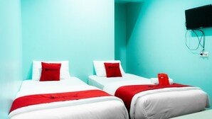 A hotel room with two beds, each with white bedding and red accents, and a flat-screen TV mounted on the wall. - RedDoorz near Gajah Mada Street Semarang (Semarang)