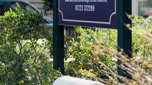 A sign for Rountree Lodge in Scarborough, including the website and contact number. - Rowntree Lodge (Scarborough)