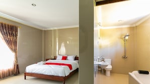 A hotel room with a bed, a bathroom with a shower, sink, and toilet. - RedDoorz near Parangtritis Beach (Parangtritis)