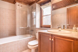 Bathtub, hair dryer, towels