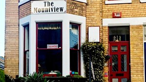 A corner building with a sign reading "The Mountview."
