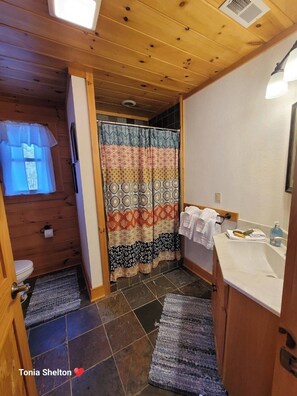 Combined shower/bathtub, hair dryer, towels, soap
