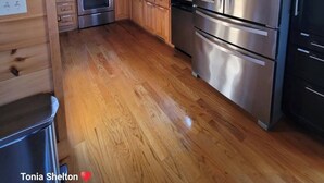 A wooden cabin kitchen with a stainless steel refrigerator, oven, microwave, and a sink. - Peaceful Blue Ridge Mountain Retreat Near Marion, NC (Nebo)