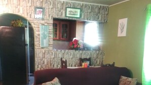 24-inch flat-screen TV with cable channels, TV - Tranquility Guest House (Buff Bay)