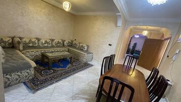 Grand Apartment, 2 Bedrooms | Living room | 32-inch flat-screen TV with satellite channels, TV