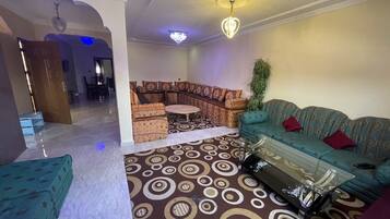 Grand Apartment, 2 Bedrooms | Living area | 32-inch flat-screen TV with satellite channels, TV