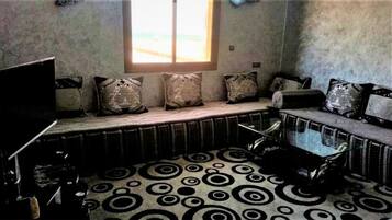 Classic Studio, 1 Double Bed | Living area | 32-inch flat-screen TV with satellite channels, TV