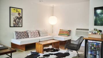 Suite, 1 King Bed, Accessible, Garden View | Living area | 40-inch LCD TV with cable channels, TV