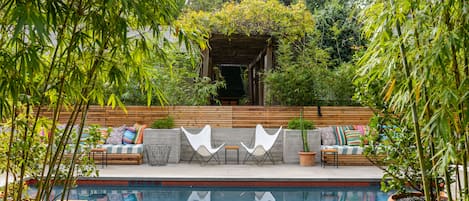 Outdoor pool, open 10:00 AM to 10:00 PM, pool loungers