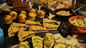 A buffet table with various food items including pastries, sandwiches, and a bowl of fruit salad. - B&B Polvere Di Stelle (Trapani)