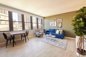 Deluxe Suite, 1 Queen Bed with Sofa bed, City View | Living area