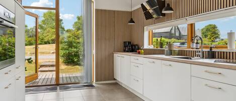 Fridge, stovetop, dishwasher, coffee/tea maker