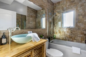 Bathtub, hair dryer, towels, soap