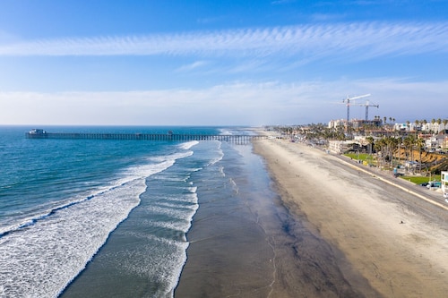 Coastal urban Castle w/ giant Ocean view Deck -BBQ and A/C-100 steps to beach!