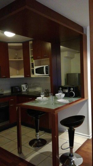 Apartamento básico | Sala de estar | TV LCD