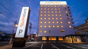 A SuperHotel with a modern design, featuring a prominent 'SuperHotel' sign and a well-lit entrance. - Super Hotel Echizen Takefu (Echizen)