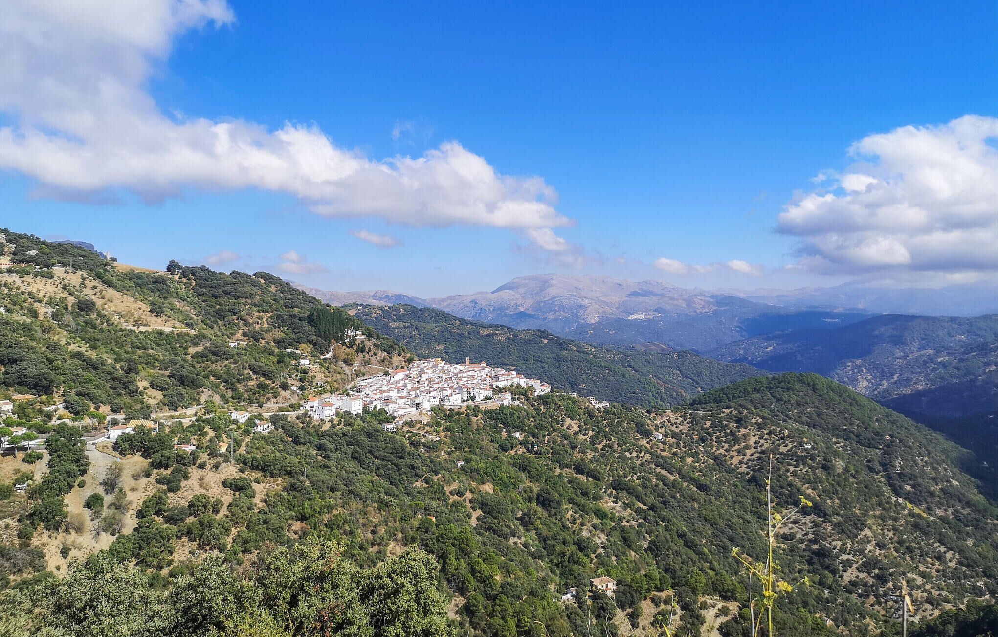 A mountainous landscape with a small town nestled in the valley.