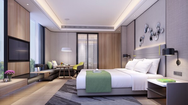 Suite, 1 kingsize bed | Donsdekens, een kluis op de kamer, een bureau, een laptopwerkplek