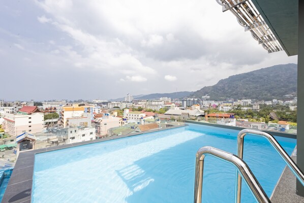 Outdoor pool, open 9:00 AM to 9:00 PM, sun loungers