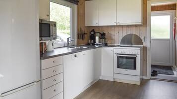 Fridge, stovetop, dishwasher, coffee/tea maker