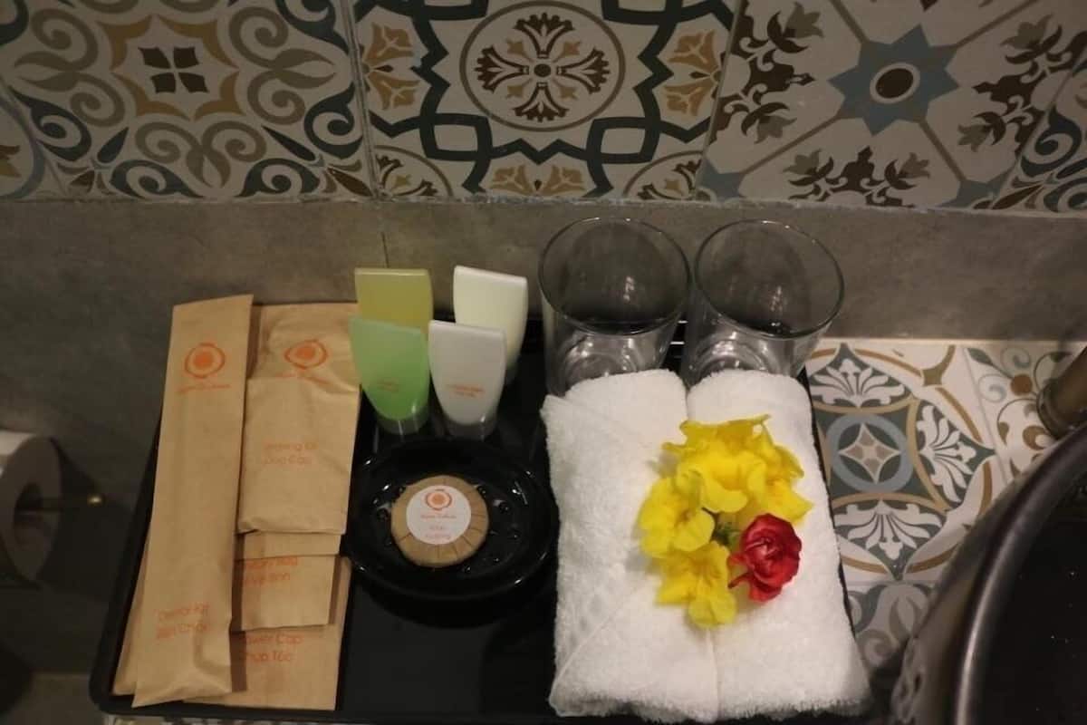 Shower, rainfall showerhead, hair dryer (on request), slippers