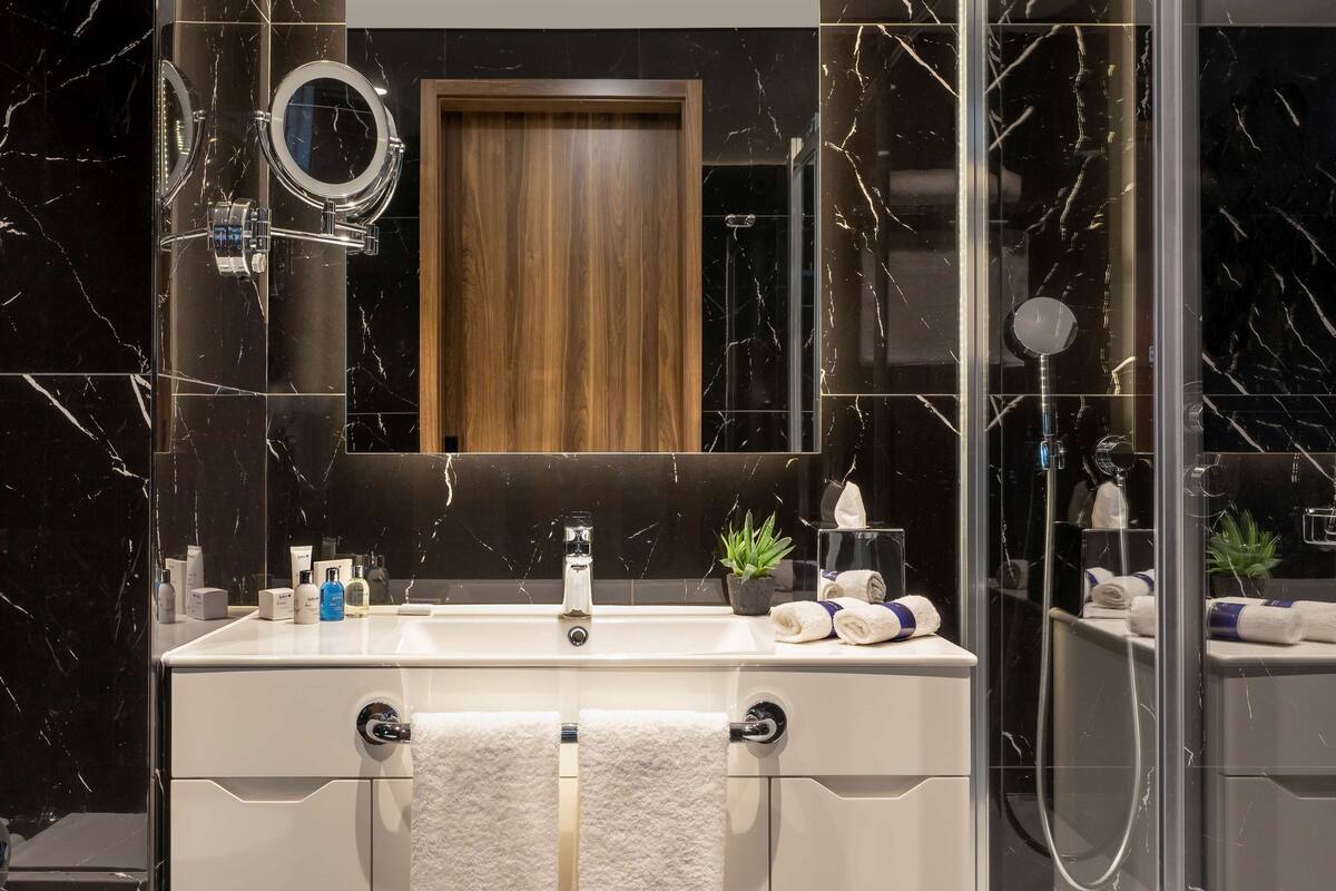 rainfall showerhead, hair dryer, slippers, bidet