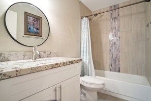 Combined shower/tub, hair dryer, towels, soap