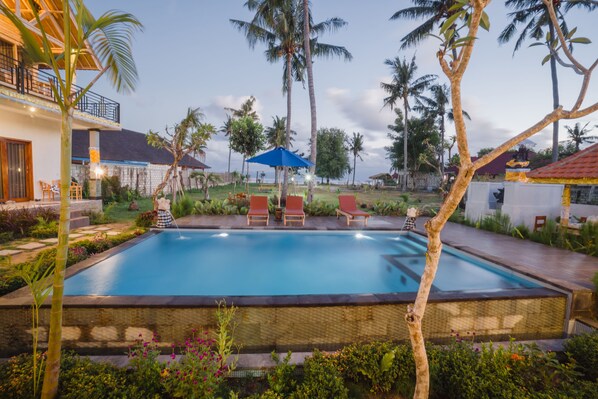 Outdoor pool, pool umbrellas, sun loungers