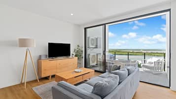 Penthouse, 3 Bedrooms | Living area | 40-inch Smart TV with digital channels, TV