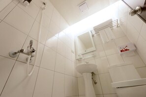 Economy Double Room | Bathroom | Shower, free toiletries, hair dryer, slippers
