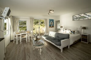 Studio (Dolphin) | Living area | Flat-screen TV - Rocklands Bed and Breakfast (Cape Town)