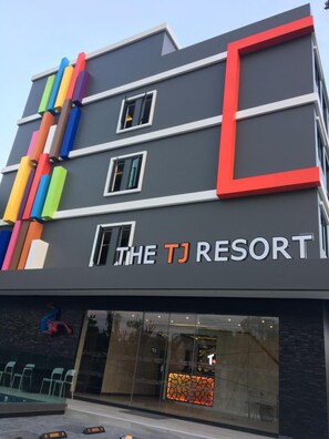 A modern building with a sign reading "THE TJ RESORT". - The TJ Resort (Pattaya)