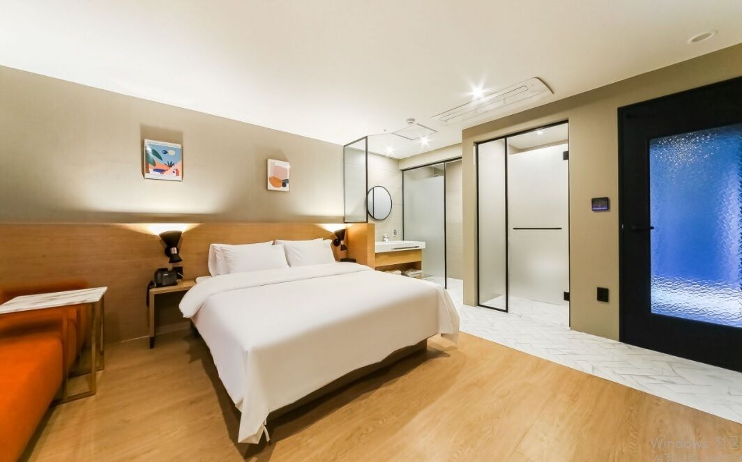 deluxe room | premium bedding, desk, laptop workspace, blackout curtains