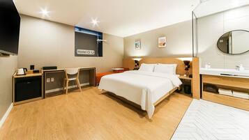 Premium bedding, desk, laptop workspace, blackout curtains